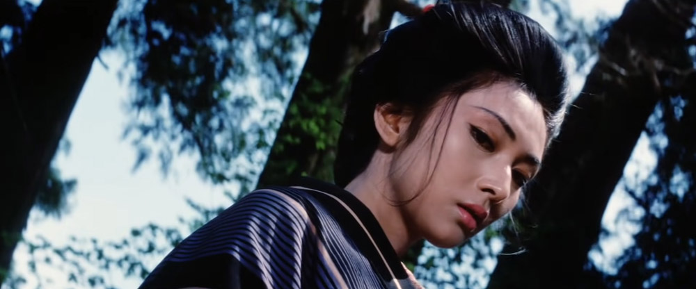 lady snowblood looking down at victim - top 10 best samurai movies