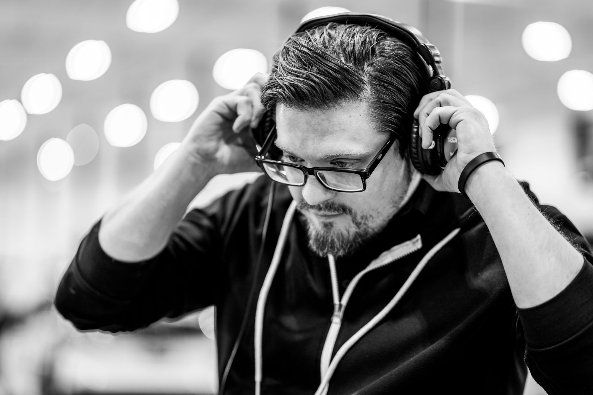 Audio professional monitoring audio during a video shoot.
